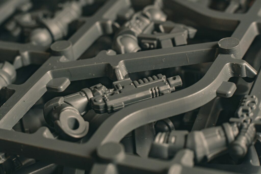 Plastic model kit sprue with various parts.